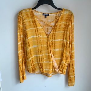 Yellow long sleeve wraparound top